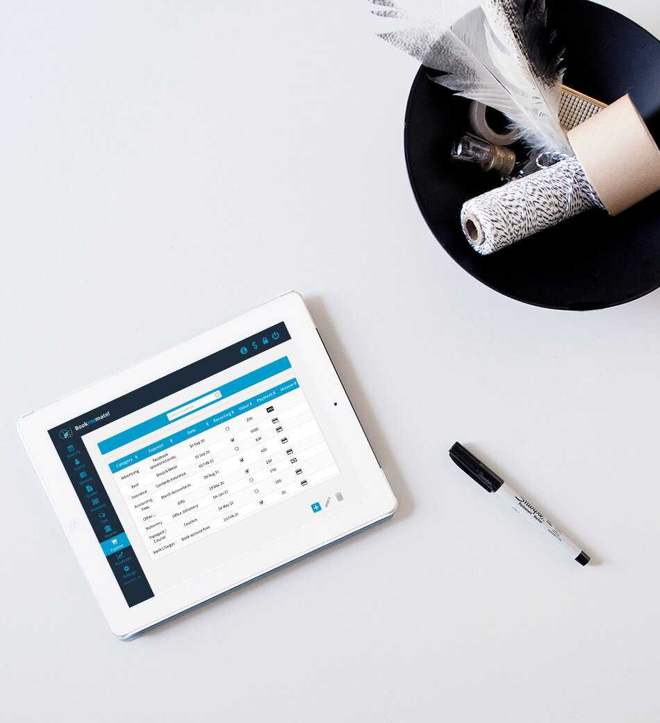 Tablet lying on table with Bookmemate`s list of expenses shown